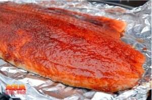 A piece of smoked Scottish salmon in aluminum foil