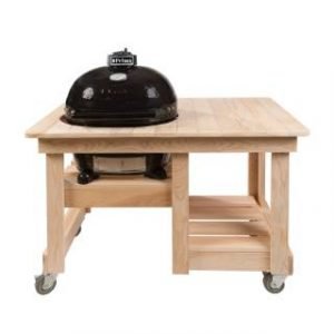 A primo grill in a wooden counter top table