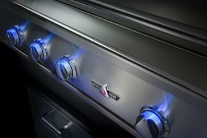 The Delta Heat grill with the knobs glowing in blue