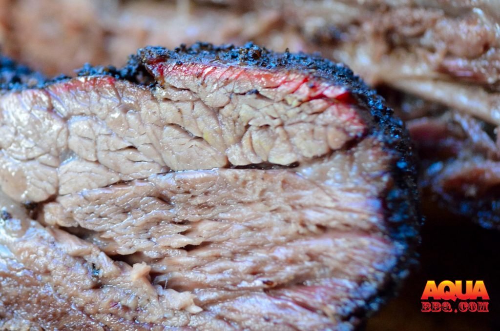 You will see a more prevalent smoke ring in areas with exposed meat vs fat cap. 