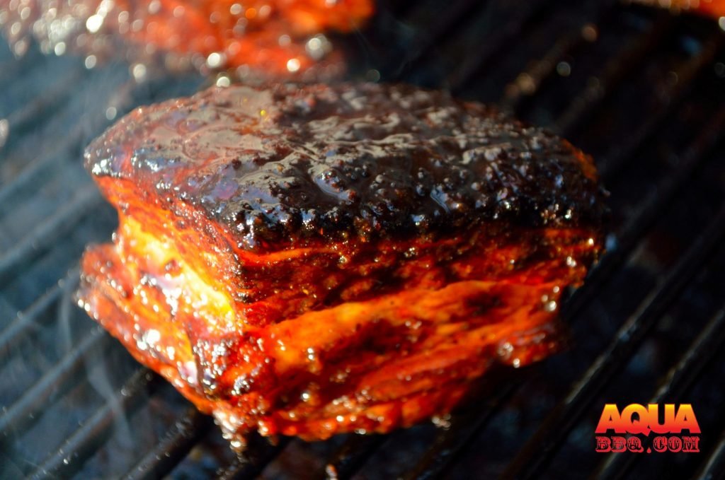 We have glazed the Smoked Pork Belly with Sucklebusters BBQ Sauce and it is approaching the finish line.
