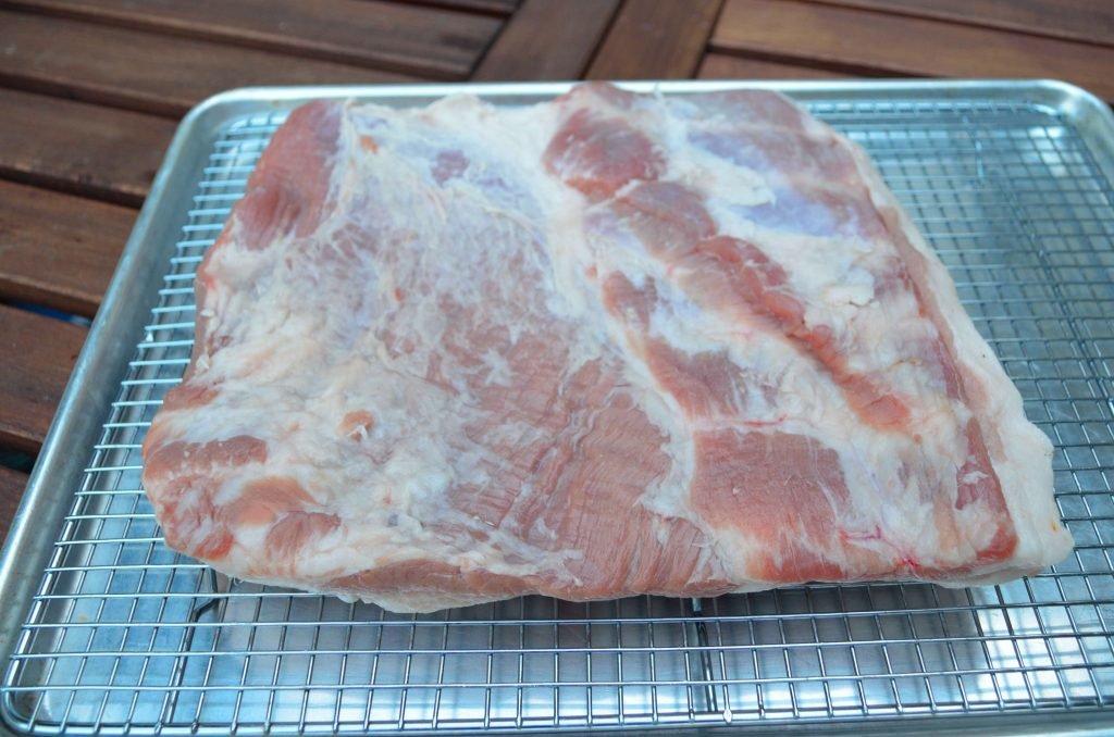 We found half of a pork belly (with the spare ribs removed) and asked the butcher to cut off the skin.  You can choose to trim more of the fat or silver skin.