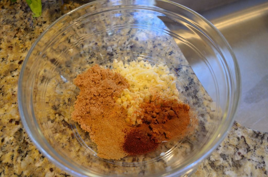 Assemble all the dry ingredients of the marinade before adding the oil and vinegar.