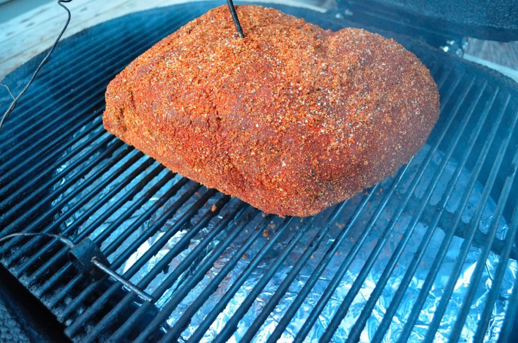 Smoke with about 4-5 cups of an apple/hickory chip combination. Add a couple chunks of hickory as well. Smoke at 225 until the internal temperature is 195 to 200. This may take 12-16 hours. 