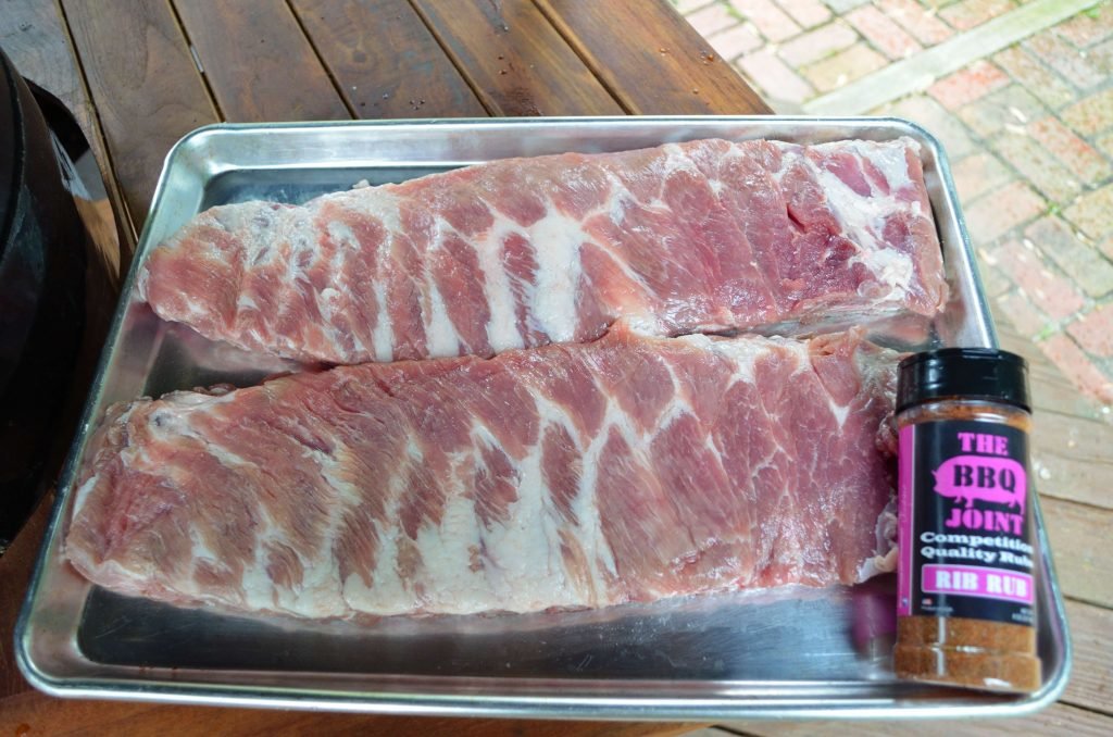 You will want to start by trimming your spare ribs St. Louis style and by removing the membrane on the back of the ribs.  At this point you want to either brine or inject the ribs.