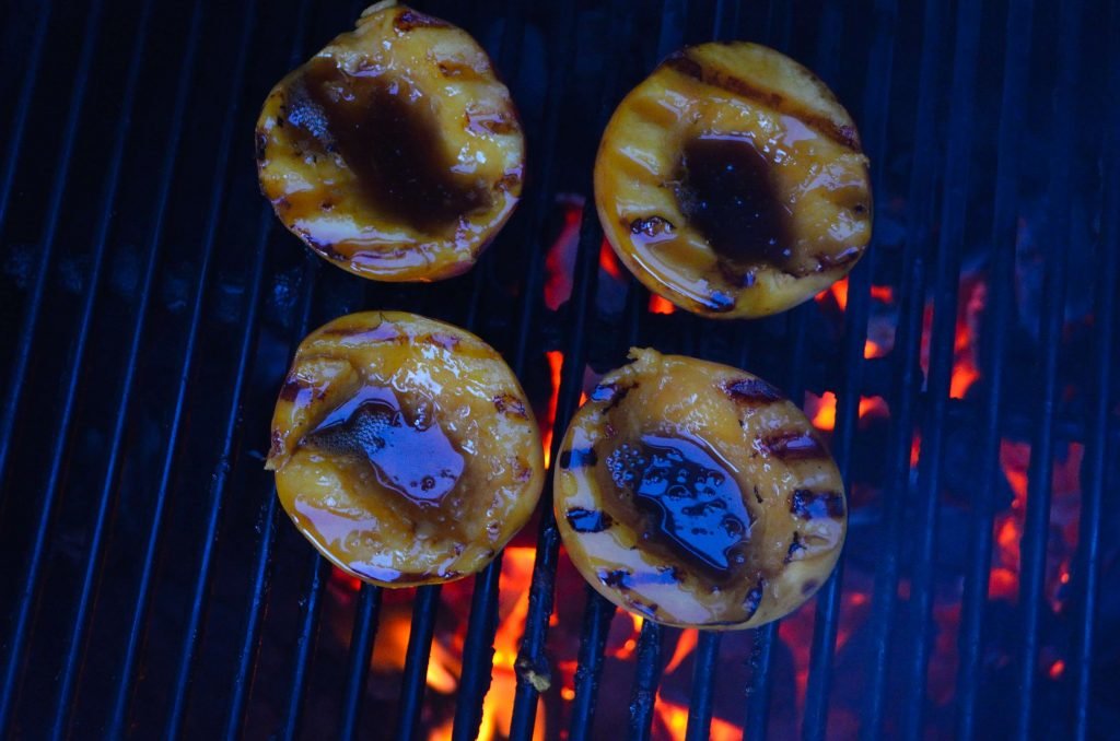 Once you turn the peaches over glaze them with the buttered rum sauce.  They will only need a few more minutes.