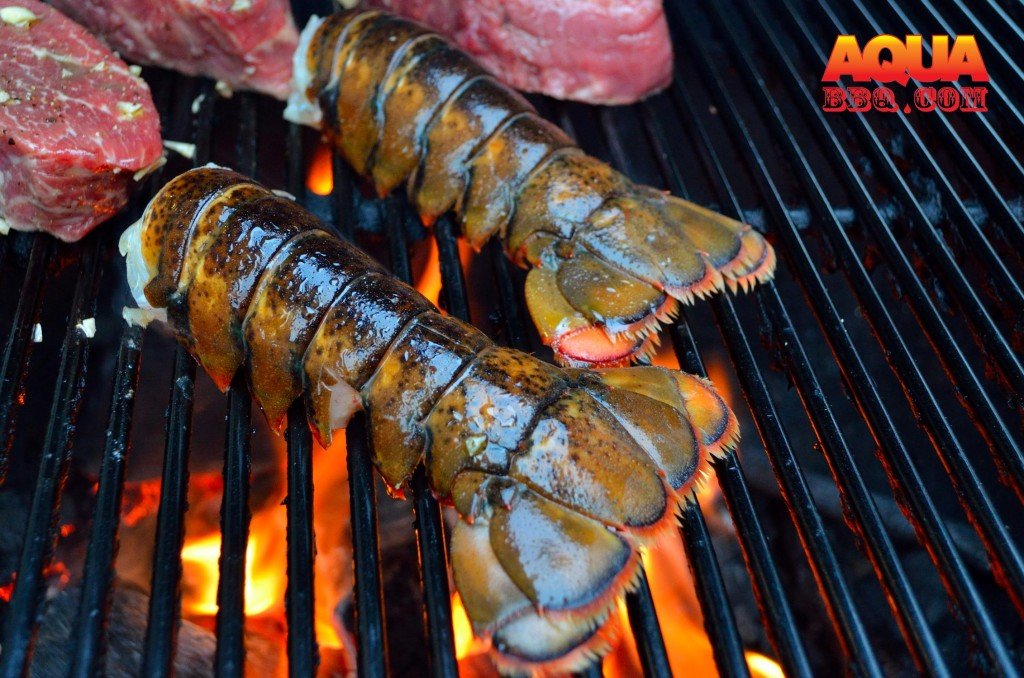 When ready, cut a slit in the underside of the tail. Put lobster open side down on the open flame