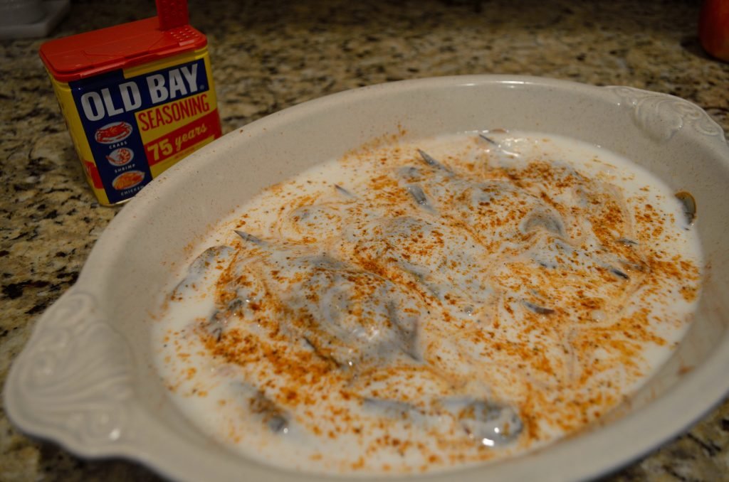 Generously season the crabs with Old Bay and then cover with buttermilk.  Add another sprinkle of Old Bay on top and let them rest in the fridge for 30-60 minutes. 