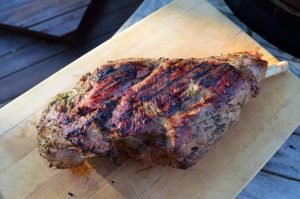 A Griled leg of lamb finished on the cutting board