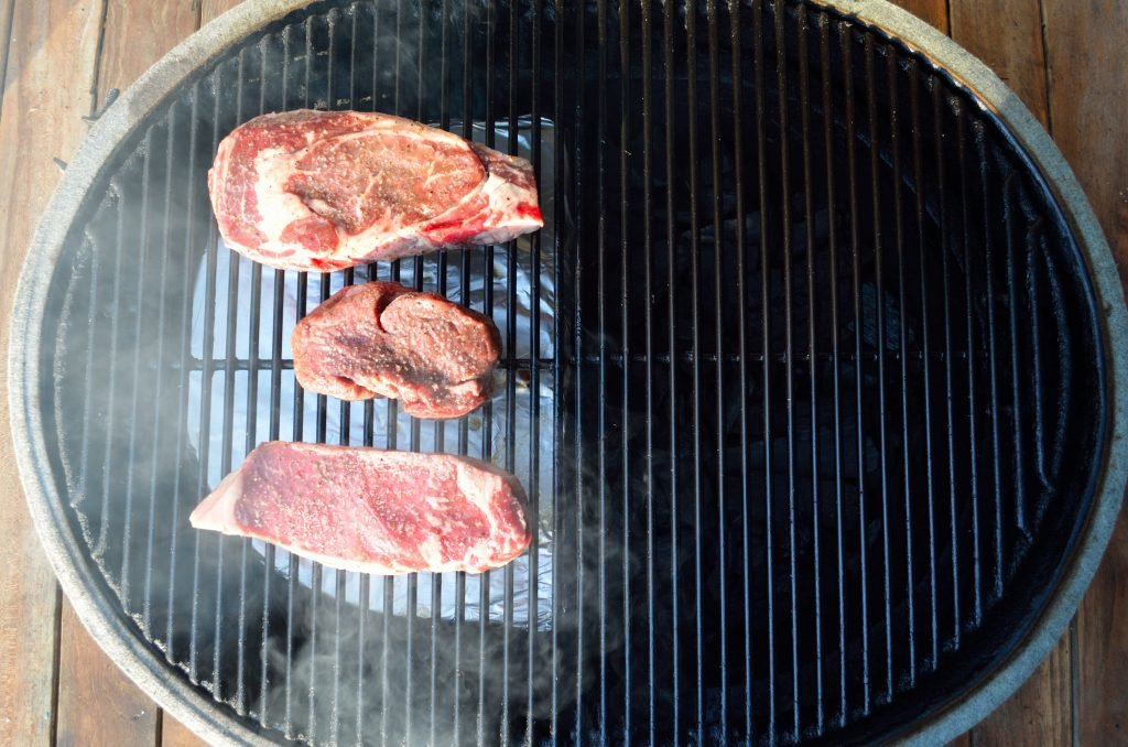 Start by seting  the Primo up for two zone cooking
