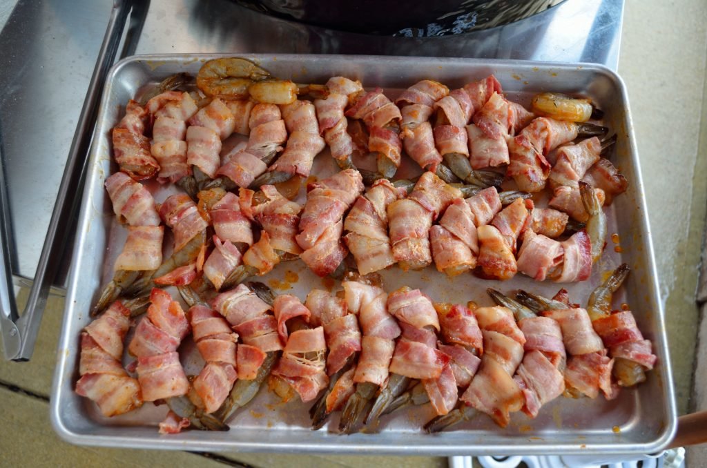 After letting the bacon cool for a couple minutes wrap each shrimp.  The ratio of shrimp to bacon was pretty even- we only had 3 lonely shrimp.