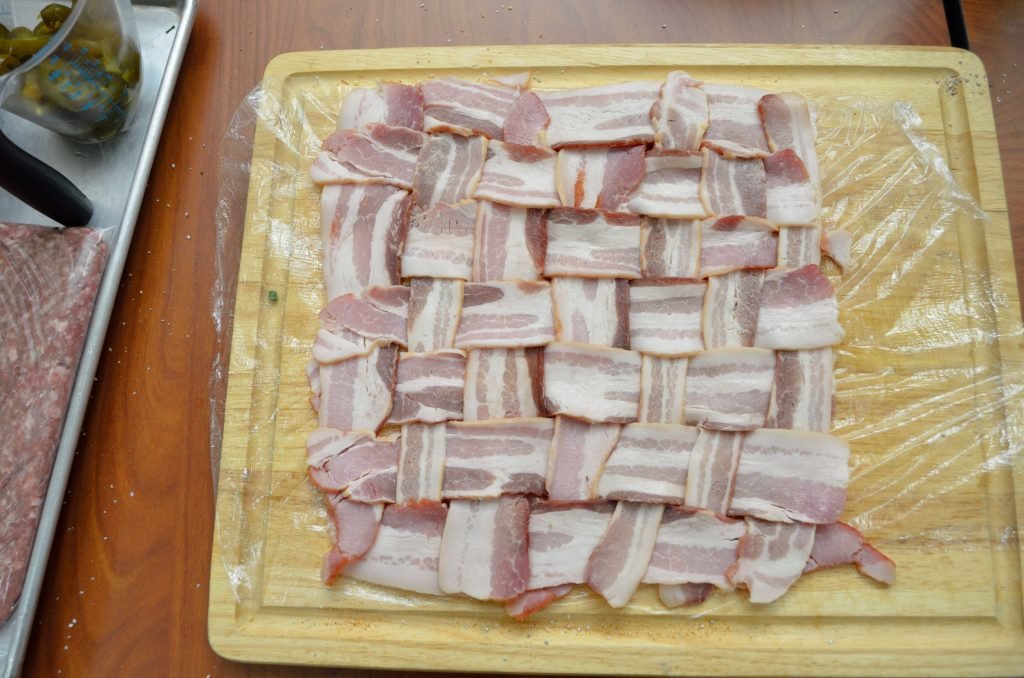 Start with a bacon weave - we went 7 x 7 and put it on plastic wrap to help when ready to roll.