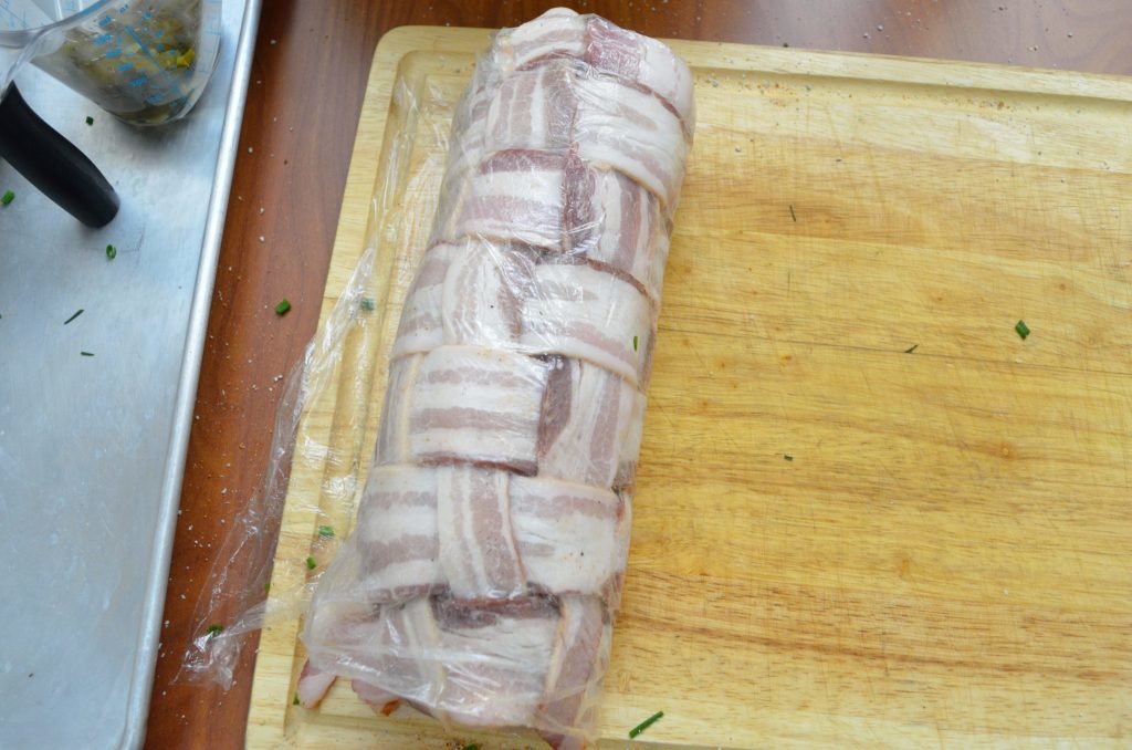 Roll the fatty as tightly as possible in the plastic wrap. Take care to press the beef together on the ends and along the roll where it comes together to seal the filling.