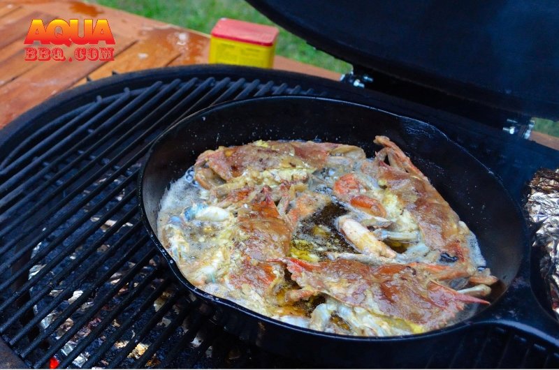 Soft crabs in a pan that is on a grill