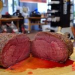A piece of roast beef cut in half